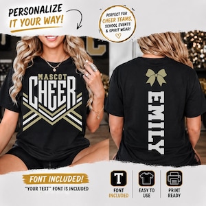 May include: A black t-shirt featuring a front graphic with the text MASCOT CHEER in white and gold, and a back graphic with a gold bow icon above the vertical text EMILY in white. The design includes geometric chevron lines in white and gold.