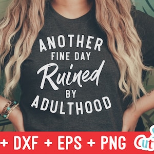 May include: A dark grey t-shirt with white text that reads "Another Fine Day Ruined By Adulthood".