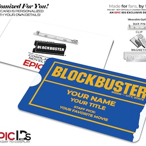 May include: A blue and yellow Blockbuster-themed name tag with customizable fields for name, title, and favorite movie. The tag includes the text "Your Name", "Your Title", and "Your Favorite Movie". The back of the tag is white and includes a pin.