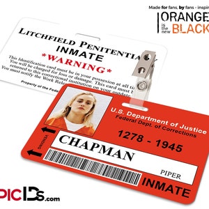 May include: Two ID badges, one white and one red, with the text "Litchfield Penitentiary Inmate" and "U.S. Department of Justice." The red badge features a photo and the name "Chapman." The image includes the text "Orange is the New Black."