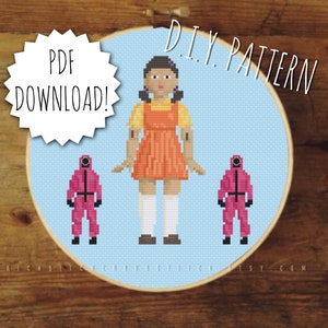 May include: A cross-stitch pattern featuring a girl in a yellow and orange dress with two figures in pink jumpsuits. The pattern is titled "DIY Pattern" and includes the text "PDF Download!"