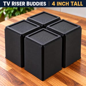 May include: Four black square TV Riser Buddies, each 4 inches tall, featuring a textured top surface and smooth vertical sides. The set is arranged in a cluster, with the text TV RISER BUDDIES | 4 INCH TALL displayed at the top of the image.