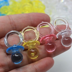 Small transparent plastic pacifier party favors for baby boy shower, or baby girl shower, gender reveal, baby shower games. (1-dozen)