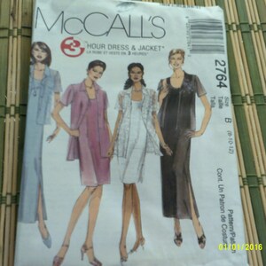 May include: McCall's sewing pattern for a dress and jacket. The pattern number is 2764 and the size is B (8-10-12). The pattern is for a 3-hour dress and jacket.