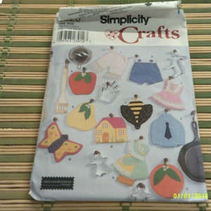 May include: Simplicity Crafts pattern for making wooden ornaments. The pattern includes designs for a butterfly, pear, apple, house, bee, tie, dress, shirt, shorts, and more.