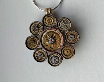 Recycled Watch Piece Spring Case Flower Pendant with Brass and Ruby Centre