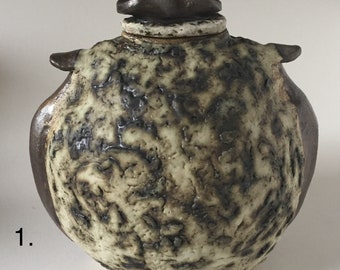 Urn , Beautiful Hand formed Ceramic with individual Textured surface .