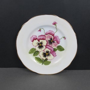 Art Deco hand painted plate. Pink and cream pansies - beautifully painted. Vintage plate hanger on the back. Decorative floral plate.