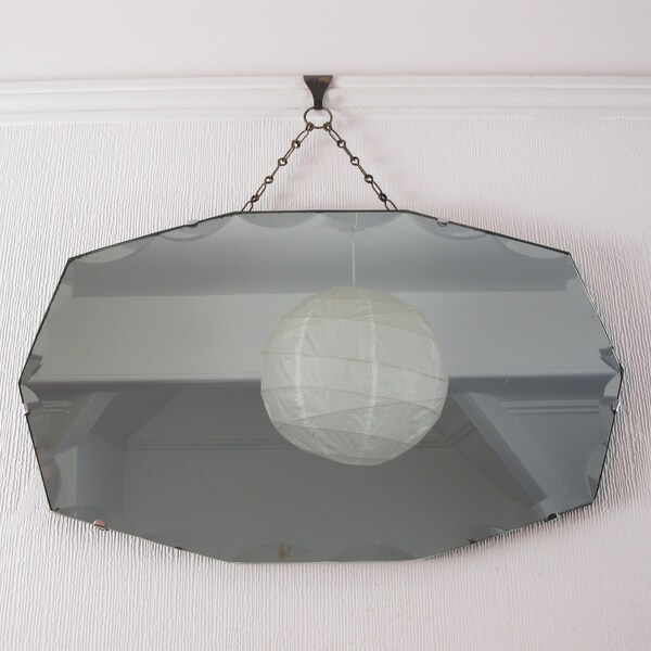 Art Deco Bevelled Edge Mirror.  10 sided frameless wall mirror with scalloped edge. Ready to hang on original visible chain.
