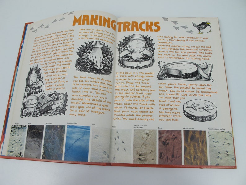 May include: Open book page with the title "MAKING TRACKS" and illustrations of animal tracks. Instructions on how to make plaster casts of tracks are included. Features examples of various animal tracks, including fox and rabbit.
