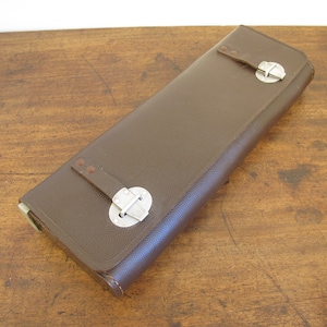 Vintage leather case. Rectangular stiff leather fold over case, with silvertone buckles. Satz tool case. 12.5 x 4.5 inches (32 x 11cm)