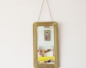 Rectangular Brass Bevelled Wall Mirror with Snakeskin Pattern. Original long visible chain