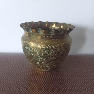 Vintage brass planter. Small, ruffled edge ornate bird design 4 inches high