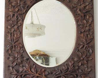 Large Hand Carved Oak Framed bevelled wall Mirror. Foliage motif.