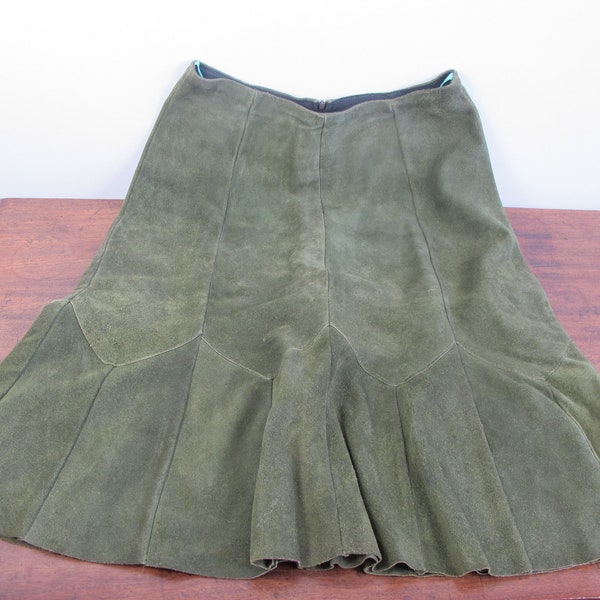 Vintage green suede skirt. Panelled and flared below the knee length. Waist approx 26 inches (66cm)