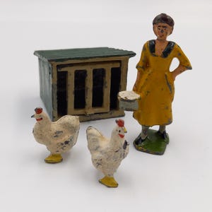 Vintage lead farmer's wife, chicken coop and two chickens figurines. Model farm toys