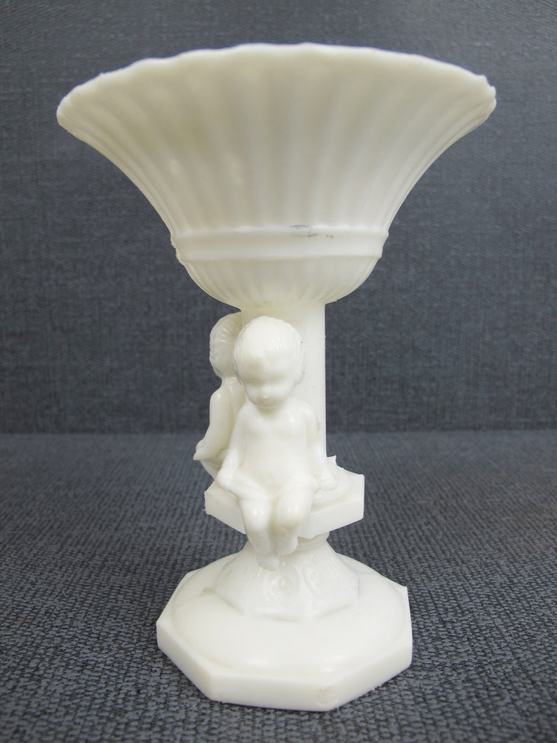 Small raised plastic planter Vintage white plastic urn with two cherubs Air plantcactus display planter. Kitsch cuteness