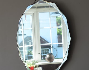 Large Round (12 sided) Art Deco Frameless Mirror with decorative deep bevel. Ready to hang on original visible chain.