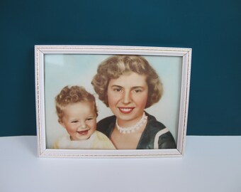 Charming vintage framed family photograph. Glamorous woman and child, blond curly hair, lipstick. Mid century colour photograph framed