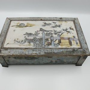 Vintage tin. Lovely very faded Art Deco footed tin with bird and flower decoration.