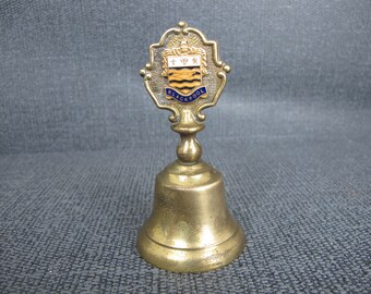 Vintage brass hand bell with enamel Blackpool shield handle. Lovely sound! 4 inches tall