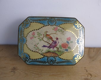 Vintage octagonal biscuit tin. Lovely bird decoration, with blue and gold  detailing. Peak Freen and Co. 1950s