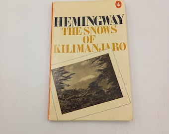 The Snows of Kilimanjaro by Hemingway. Penguin classic orange paperback book. Classic literature, 1975 edition