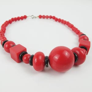 Vintage red and black plastic beaded necklace. Great colours, a mix of different shape beads. Eighties vintage beads. Statement necklace