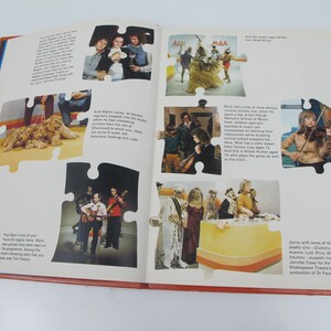May include: Open book with various images of people and events, including a group of musicians, a woman playing the violin, and a group of people in costumes. The pages are white with text and images.