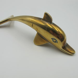 Vintage brass dolphin figurine. Very cute! 4.5 inches long