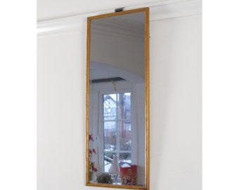 Miroir vintage avec cadre en bois effet bambou.