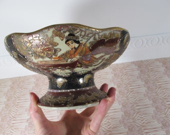 Antique highly decorated raised bowl. Ceramic dish with raised gold detailing. Plenty of age and character.