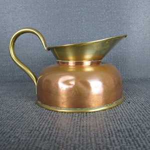 Vintage copper and brass jug. Small squat jug.