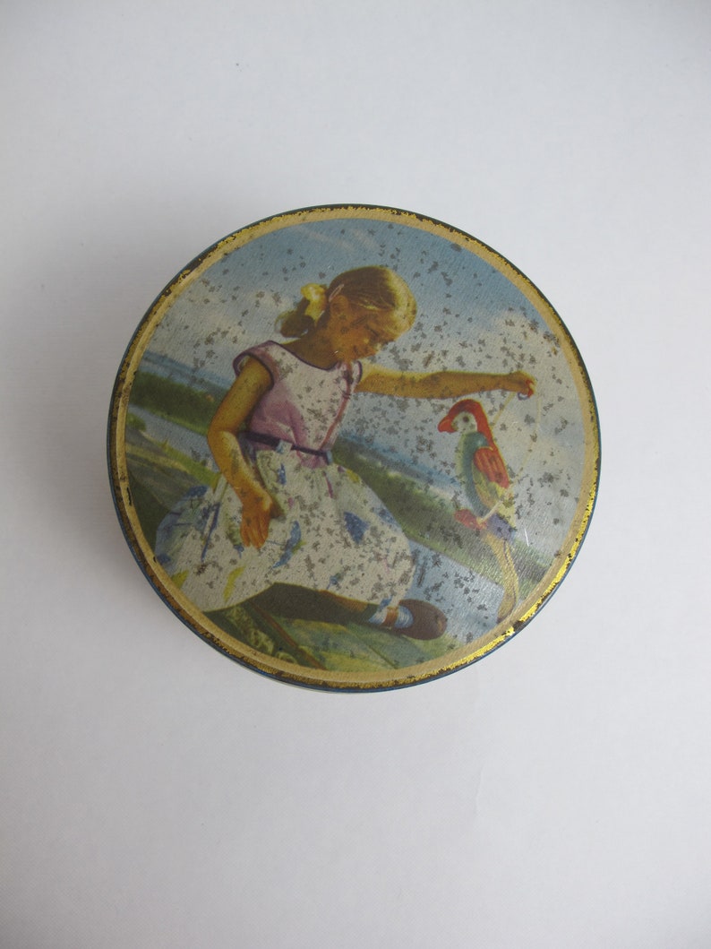 Vintage round tin Made in England. Small round toffee tin girl with parrot Edward Sharp and Sons Ltd