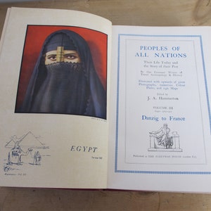 May include: An open book with a red and white cover. The book is titled "Peoples of All Nations: Their Life Today and the Story of Their Past." The book is illustrated with photographs, numerous color plates, and maps. The book is edited by J.A. Hammerton. The book is volume III and covers Danzig to France.