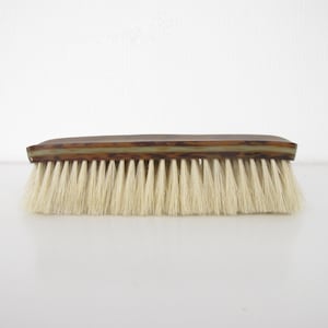Vintage clothes brush. Early marbled plastic with pure natural bristles. Stylish dressing table accessory - vintage boudoir.