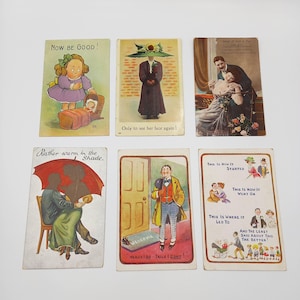May include: A collection of vintage postcards with various illustrations and text. One card features a girl with a baby, another a woman in a large hat, and others depict couples and humorous scenes. The text includes phrases like "Now Be Good!" and "Heads I do - Tails I don't!"