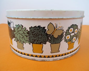 Vintage Regency Ware houseplants and butterflies tin. Funky seventies tin.Orange and black bands.