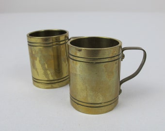 Two very small brass tankards. Banded design - nice and heavy, well made. Vintage brass home decor.