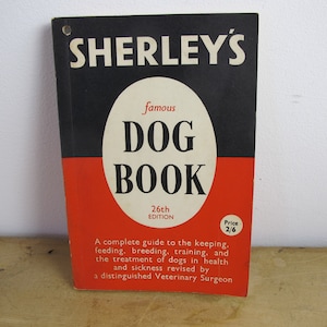 Sherleys Famous Dog book - 26th edition. Small paperback guide to keeping, breeding and training your dog. 1960s