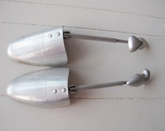 Vintage metal shoe trees. Medium size, made in Britain.