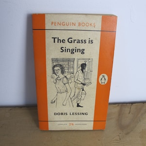 The Grass is Singing by Doris Lessing. Penguin classic orange paperback book. Classic literature, 1961 edition