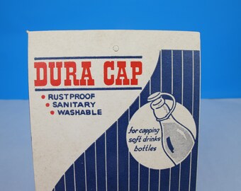 Vintage advertising sign for Dura Cap bottle tops. Cardboard shop sign. Manila shop advert. Bottle caps advert. Vintage graphics