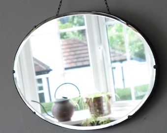 Oval Art Deco Mirror with decorative bevel. Ready to hang on long original visible chain