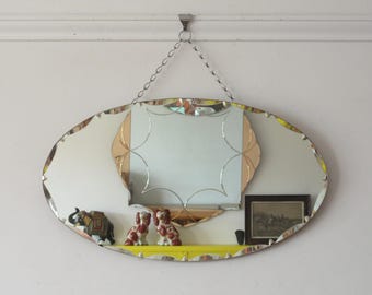 Oval Art Deco Mirror with scalloped bevel. Ready to hang on original visible chain