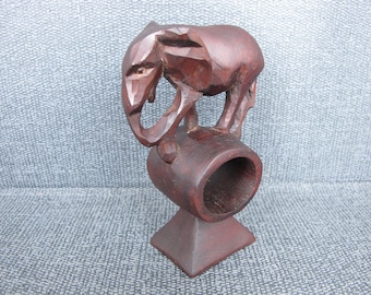 Vintage wooden elephant napkin ring. Lovely hand carved elephant, balancing on the top of the napkin ring.