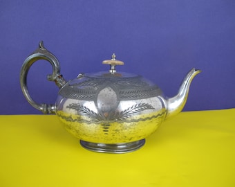 Elegant antique silver plated teapot. Great shape!