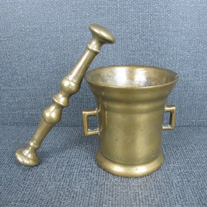Antique brass apothecary pestle and mortar. Twin handled heavy 4 inch (10cm) chemists pestle and mortar.
