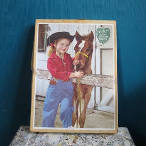 Vintage children&#39;s jigsaw girl and foal. Victory plywood jigsaw puzzle.