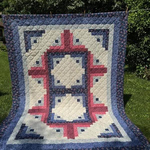 Log cabin quilted throw